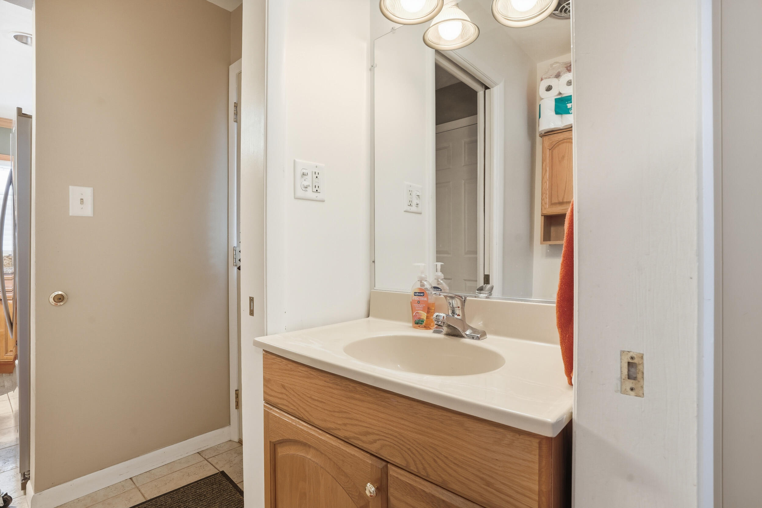 18 Timrick Drive Munster, IN 46321 - Photo 19 of 39 a bathroom with a sink and a mirror