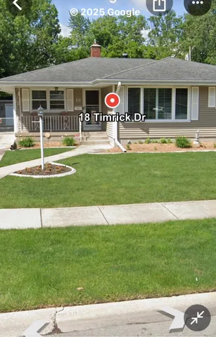 a view of an house with backyard and kitchen