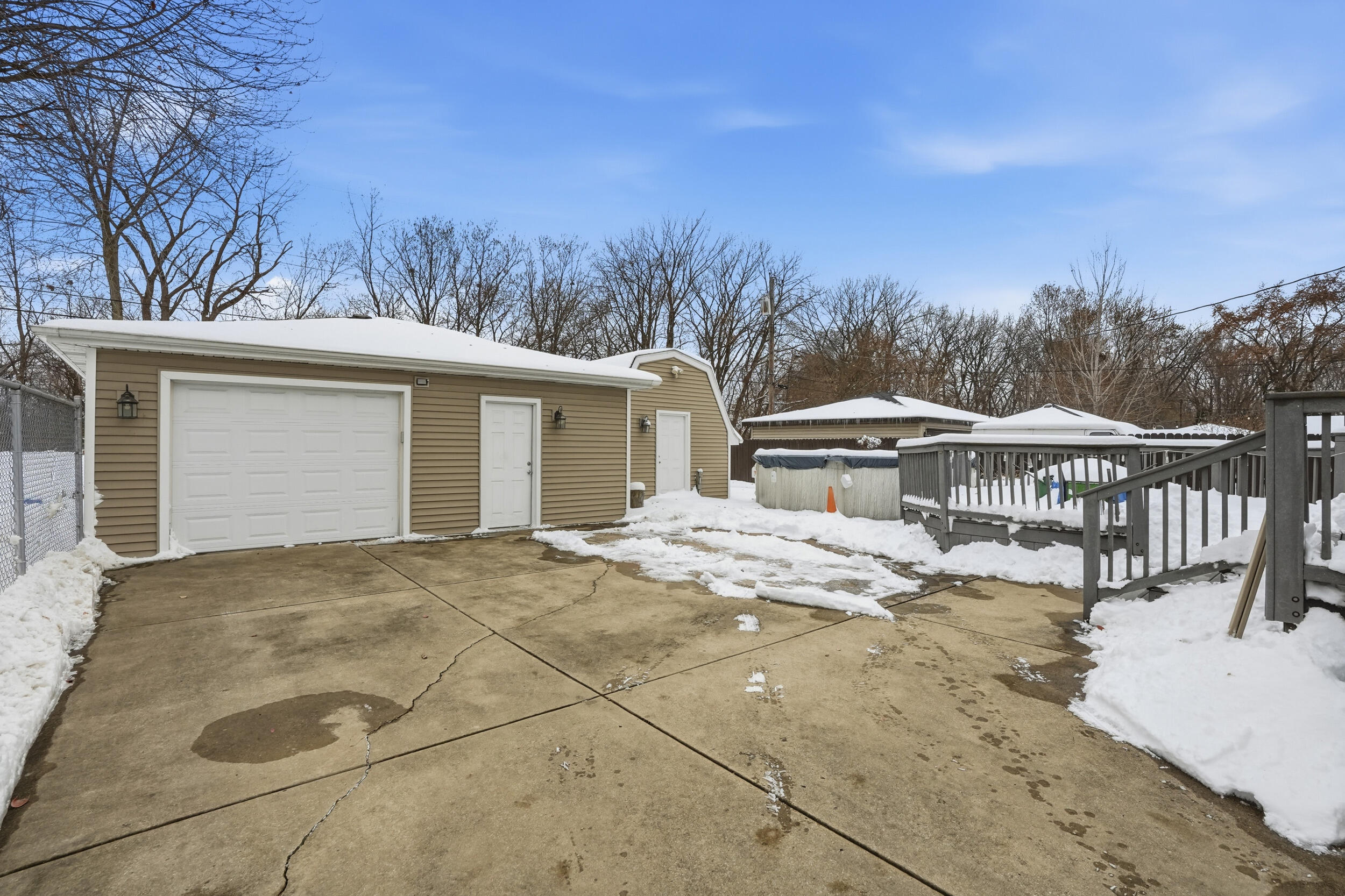 18 Timrick Drive Munster, IN 46321 - Photo 35 of 39 a view of a house with backyard and trees in the background