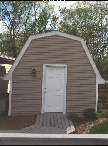 a view of a small house with a door