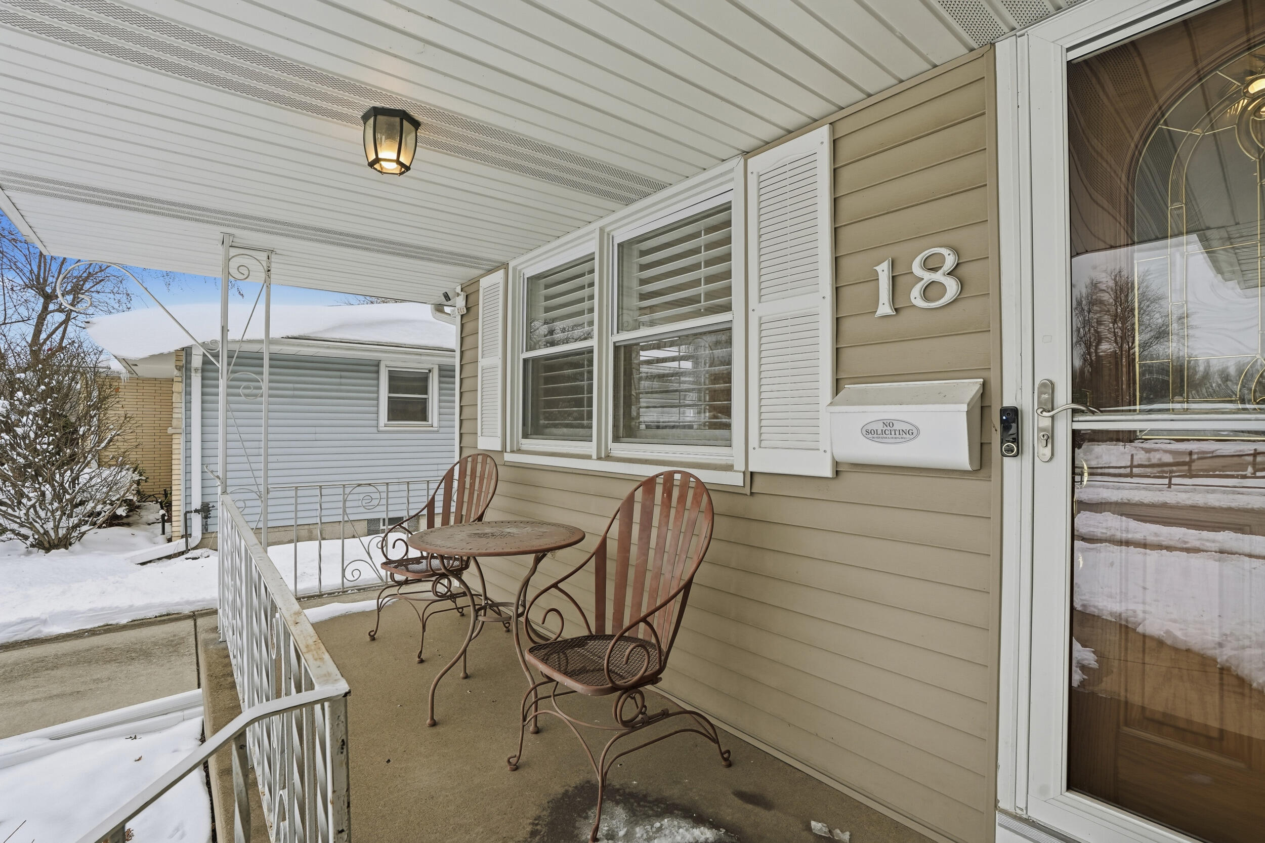 18 Timrick Drive Munster, IN 46321 - Photo 4 of 39 a view of balcony with chairs and wooden fence