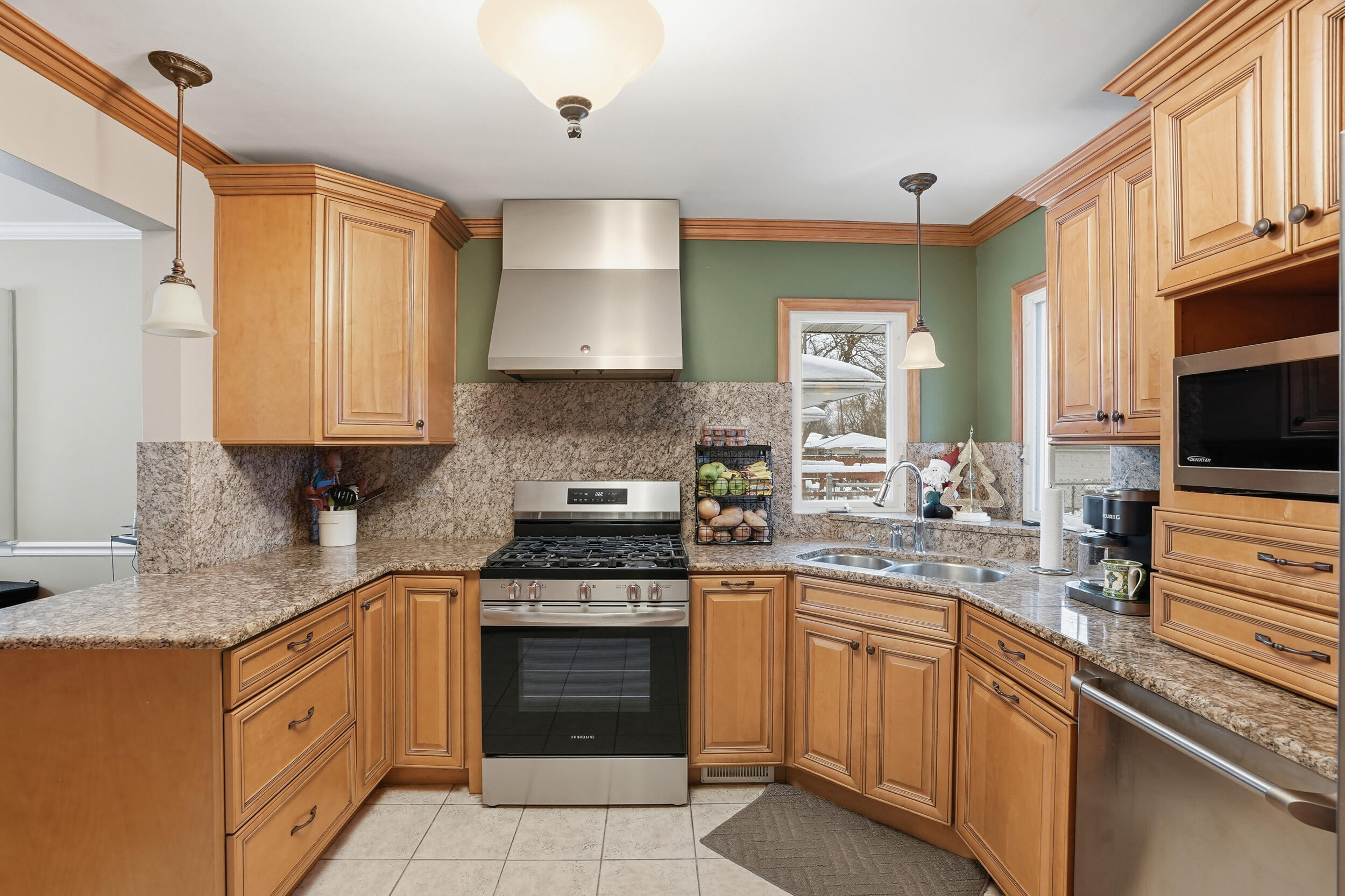 18 Timrick Drive Munster, IN 46321 - Photo 9 of 39 a kitchen with stainless steel appliances granite countertop a stove sink and cabinets