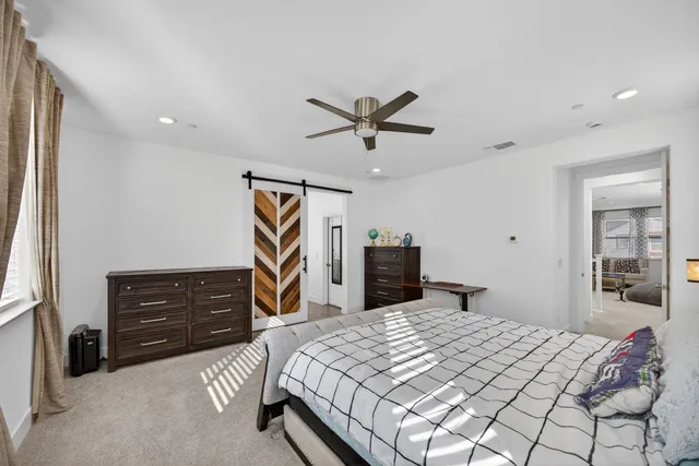 a large kitchen with a lot of counter space and wooden floor