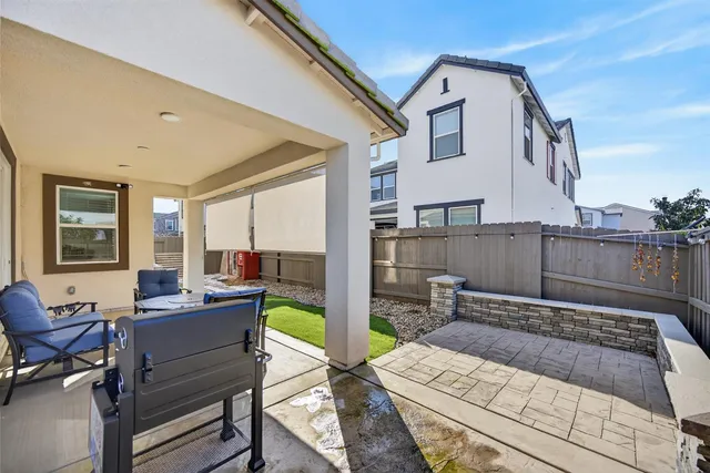 a front view of a house with white walls