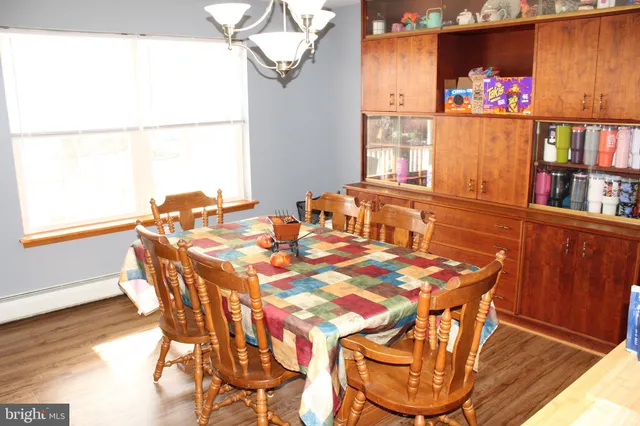 a kitchen with a refrigerator a stove a sink and a microwave