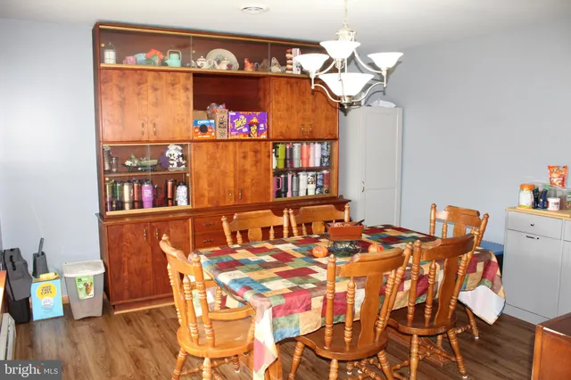 a kitchen with stainless steel appliances a refrigerator sink and white cabinets