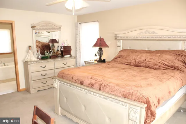 a bathroom with a bathtub and a window
