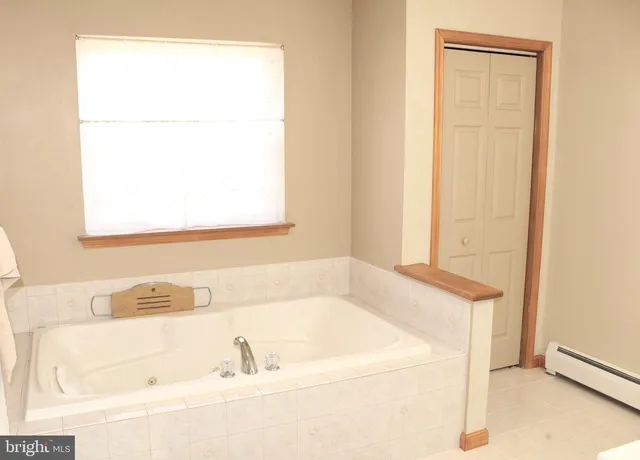 a bathroom with a sink vanity and a mirror