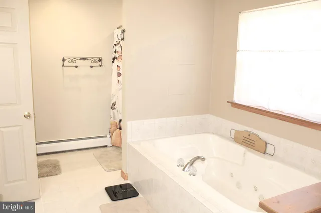 a work place with computer on desk and chair