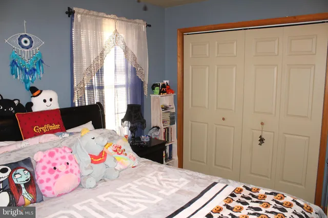 a view of a livingroom with furniture and a window