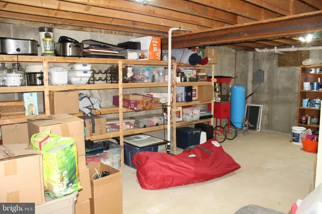 a view of a patio with table and chairs with wooden floor and fence