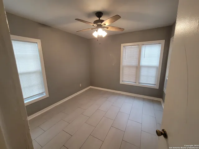 an empty room with a fireplace