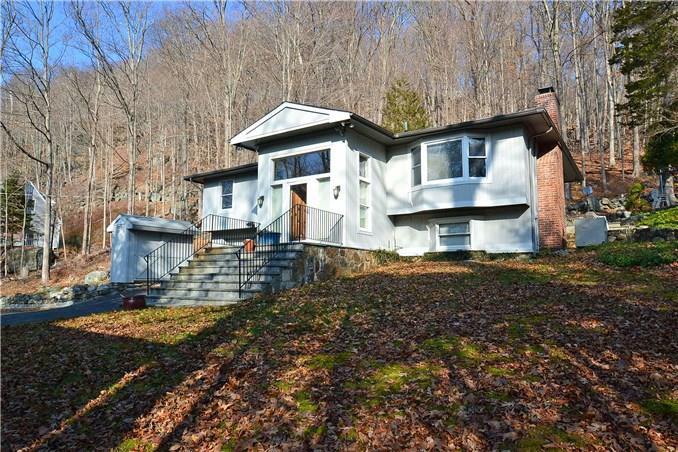 189 Ledges Road Ridgefield, CT 06877 - Photo 1 of 1 a front view of a house with a yard