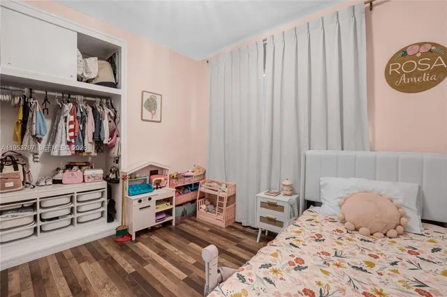 a bedroom with a bed and a cabinets