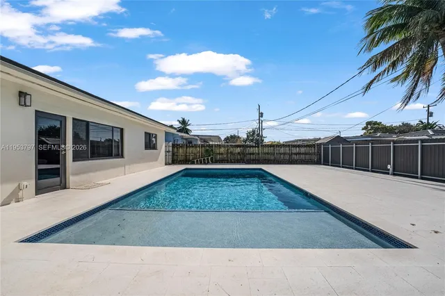 a view of swimming pool with a yard