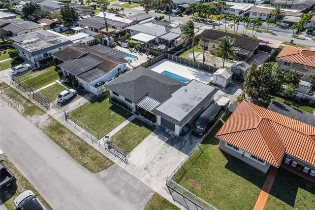 an aerial view of a house with a garden