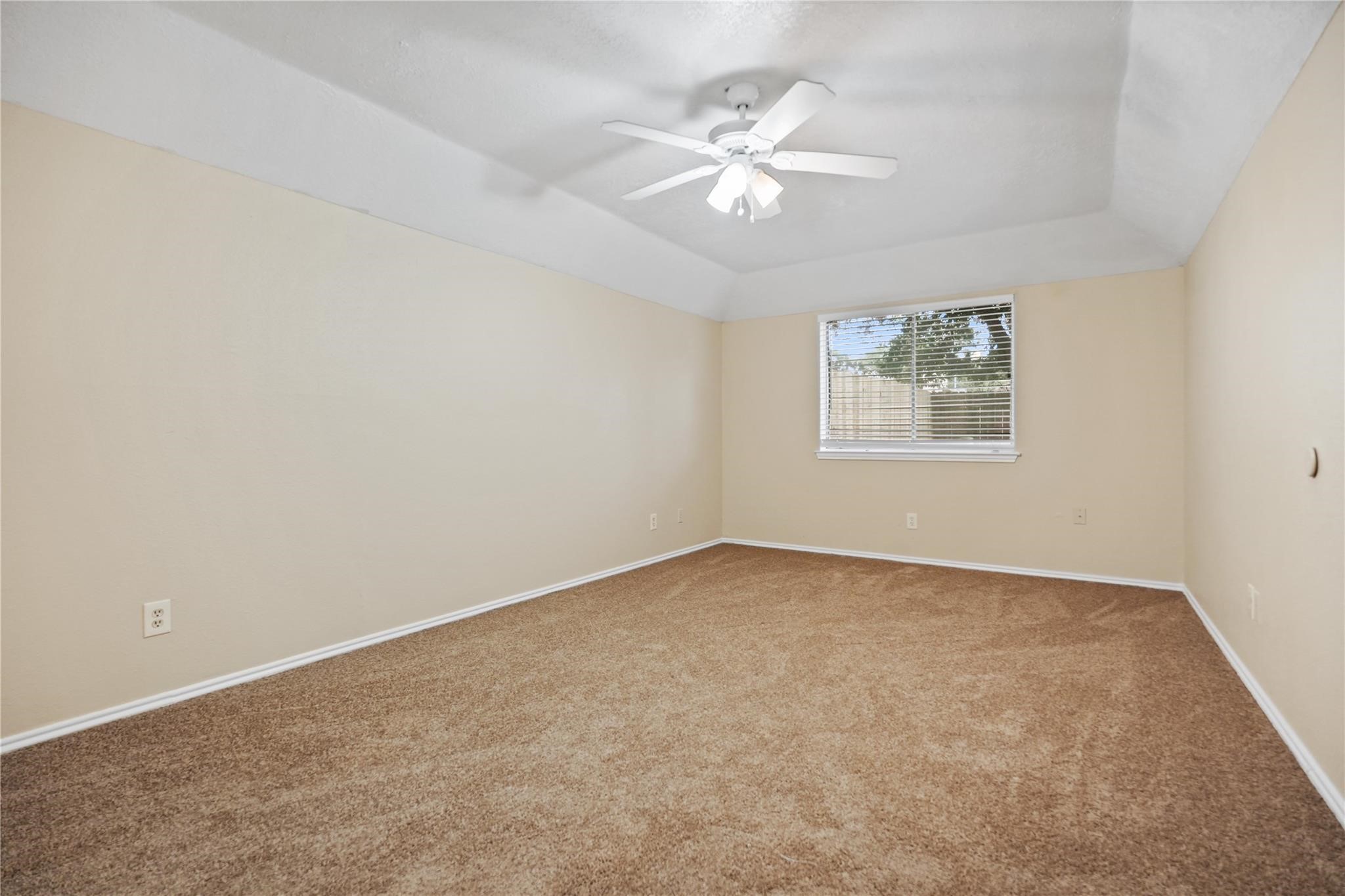 22911 Sherioaks Lane Spring, TX 77389 - Photo 13 of 26 an empty room with windows and fan