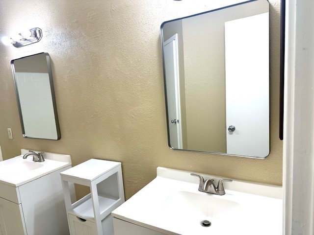 22911 Sherioaks Lane Spring, TX 77389 - Photo 14 of 26 a bathroom with a sink and a mirror