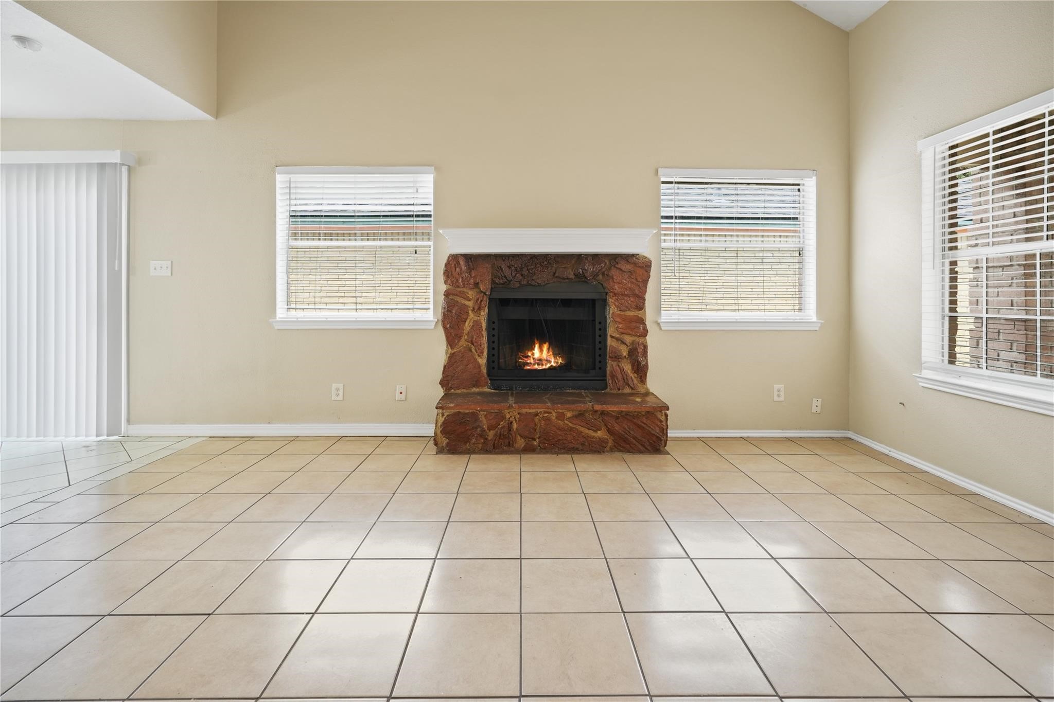 22911 Sherioaks Lane Spring, TX 77389 - Photo 5 of 26 a view of an empty room with a fireplace and a window