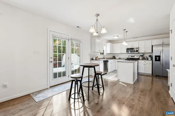 a kitchen with granite countertop a sink and a window