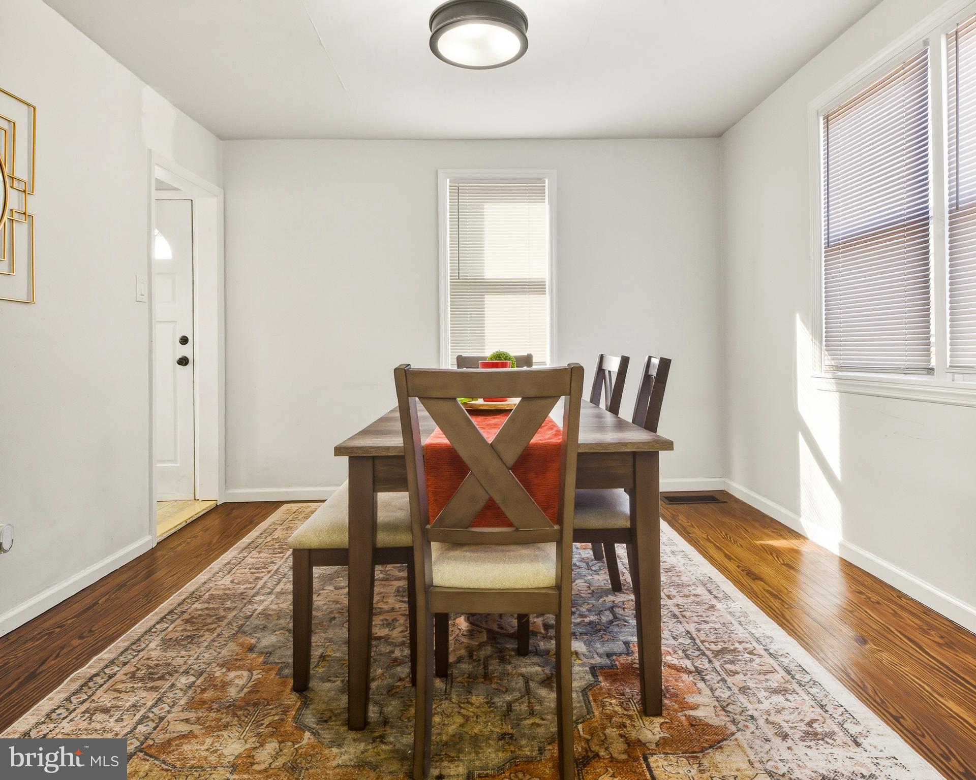 1287 Clements Bridge Road Woodbury, NJ 08096 - Photo 8 of 16 a view of a dining room with furniture and wooden floor