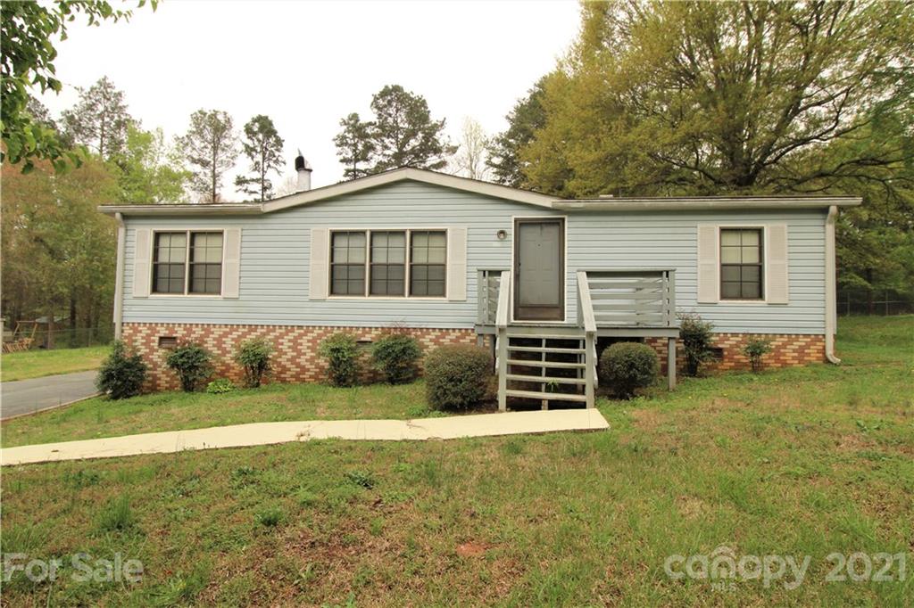 241 Gateway Farm Road Clover, SC 29710 - Photo 1 of 19 a front view of a house with a yard