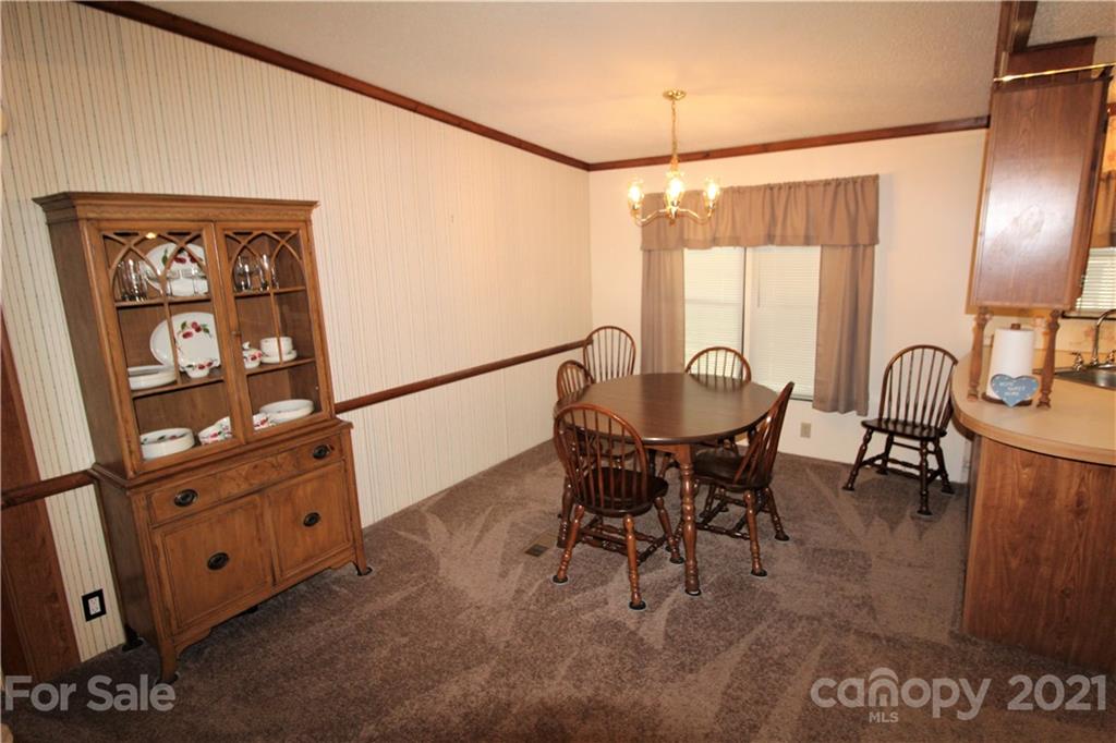 241 Gateway Farm Road Clover, SC 29710 - Photo 5 of 19 a dining room with furniture and window