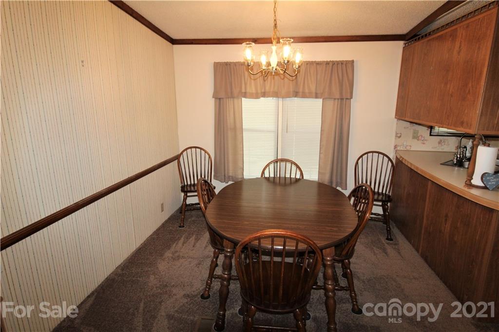 241 Gateway Farm Road Clover, SC 29710 - Photo 6 of 19 a view of a dining room with furniture and chandelier