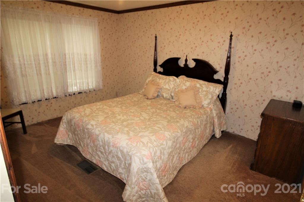241 Gateway Farm Road Clover, SC 29710 - Photo 8 of 19 a bedroom with a bed and a dresser