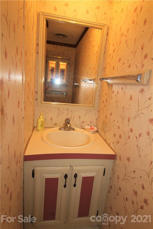 241 Gateway Farm Road Clover, SC 29710 - Photo 10 of 19 a bathroom with a sink and a mirror