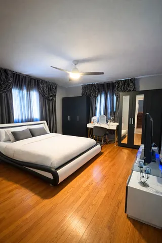 a bedroom with bed and window