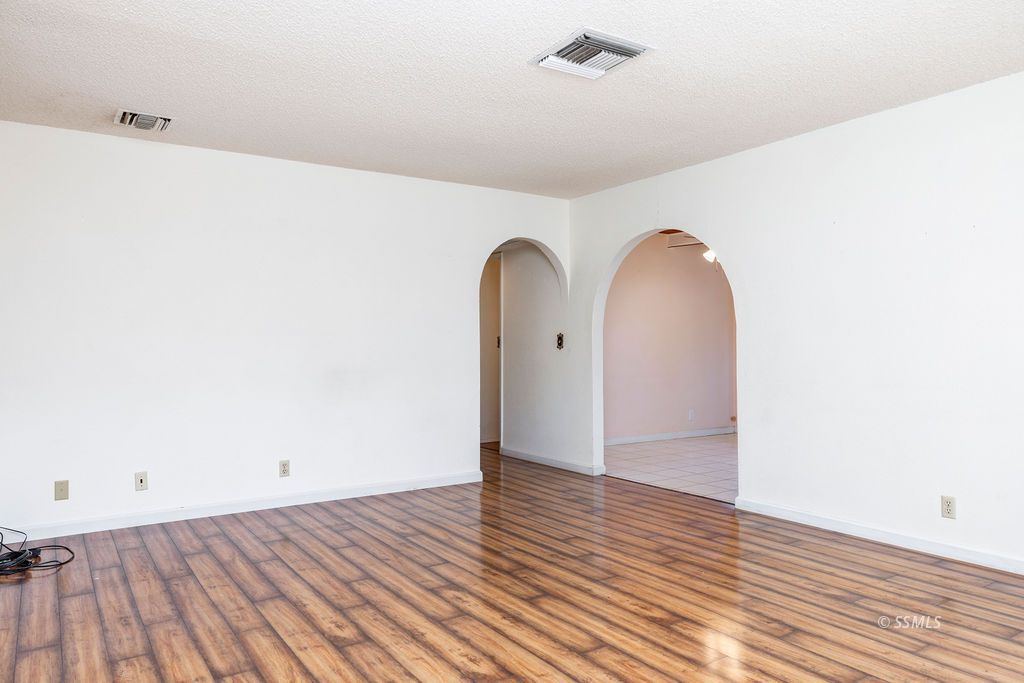 1144 West Benson Avenue Ridgecrest, CA 93555 - Photo 10 of 32 a view of a room with wooden floor