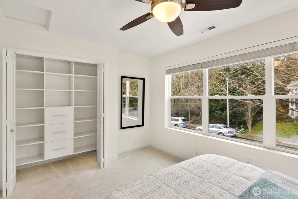 4338 28th Avenue South Seattle, WA 98108 - Photo 21 of 25 a bedroom with a bed and a large window