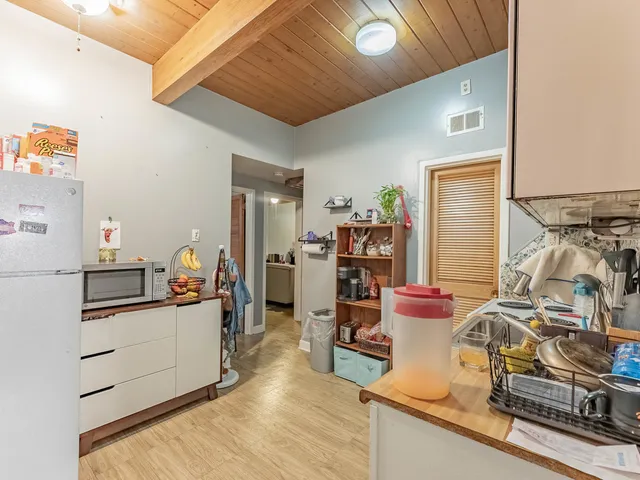 a view of a workspace with furniture and toys