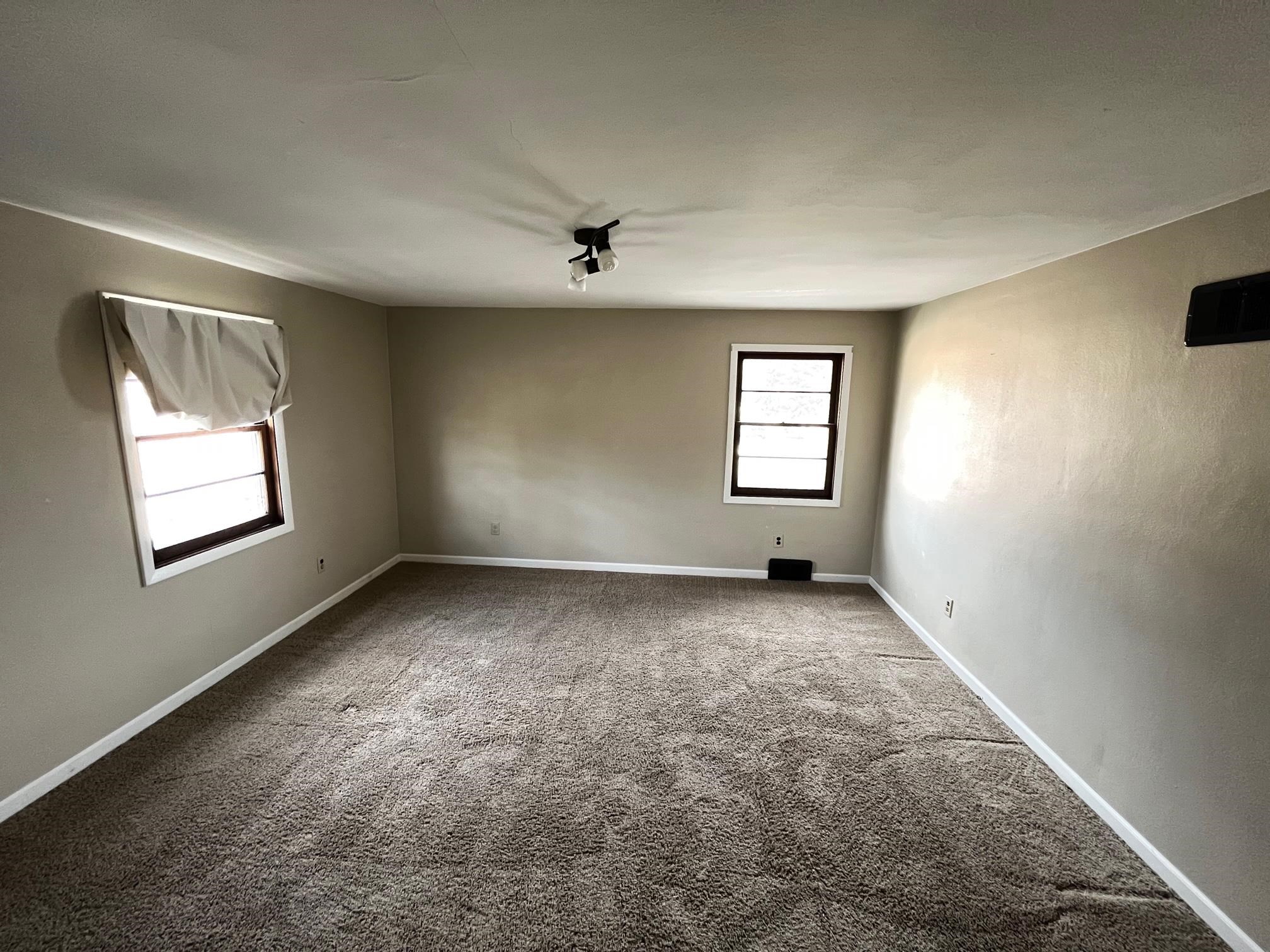 13954 Dorr Road Rockton, IL 61072 - Photo 13 of 21 an empty room with windows and closet