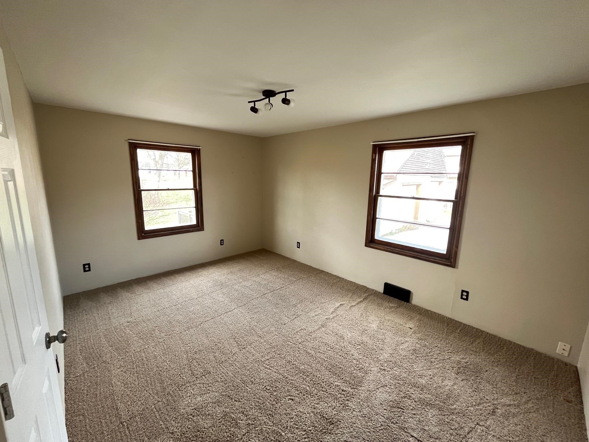 13954 Dorr Road Rockton, IL 61072 - Photo 10 of 21 an empty room with windows and closet