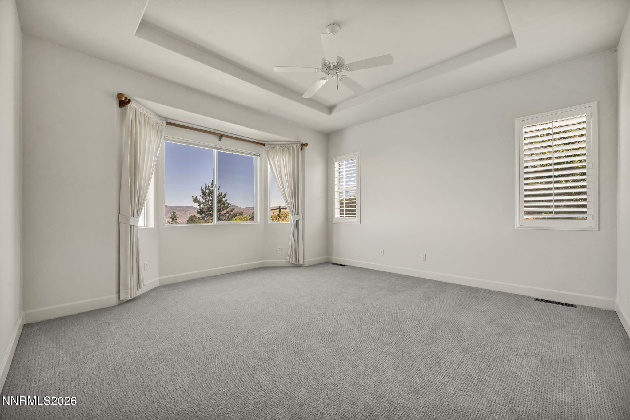 574 Echo Ridge Court Reno, NV 89511 - Photo 29 of 58 an empty room with windows and fan