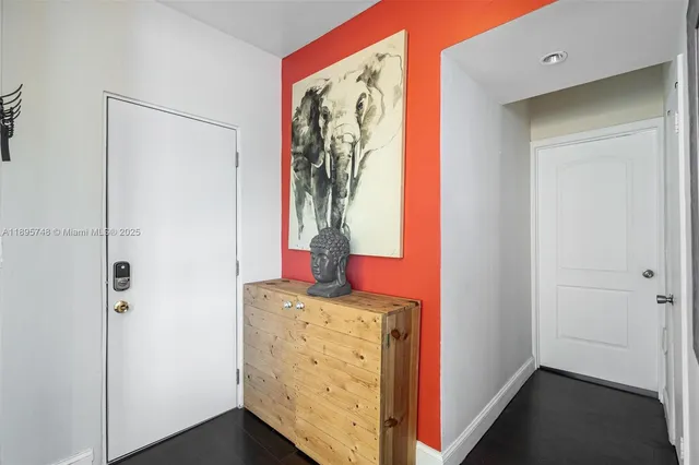 a view of a hallway to rooms