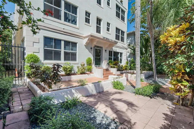 a view of a building with potted plants