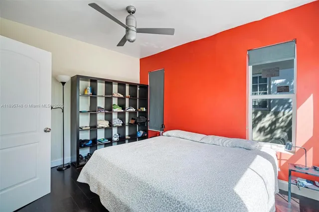 a bed room with a bed and a book shelf