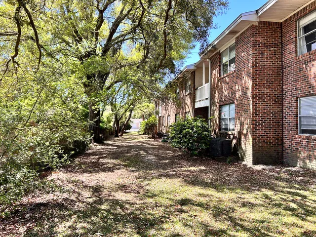 a view of a street with a building in the background