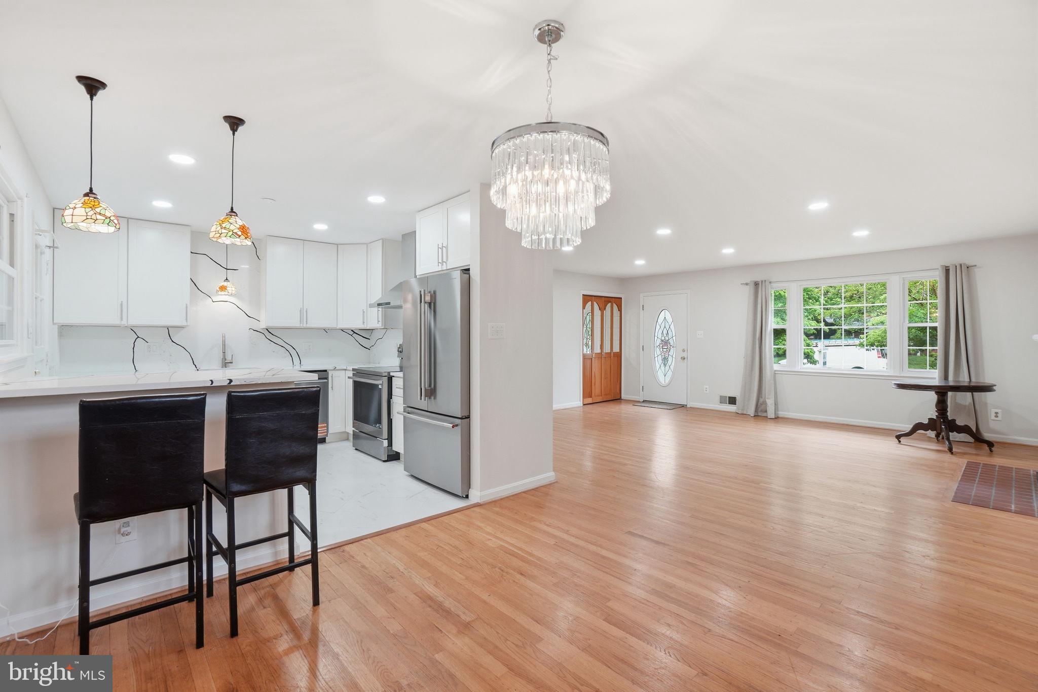 5304 Pillow Lane Springfield, VA 22151 - Photo 3 of 32 a view of a kitchen with dining table appliances and wooden floor