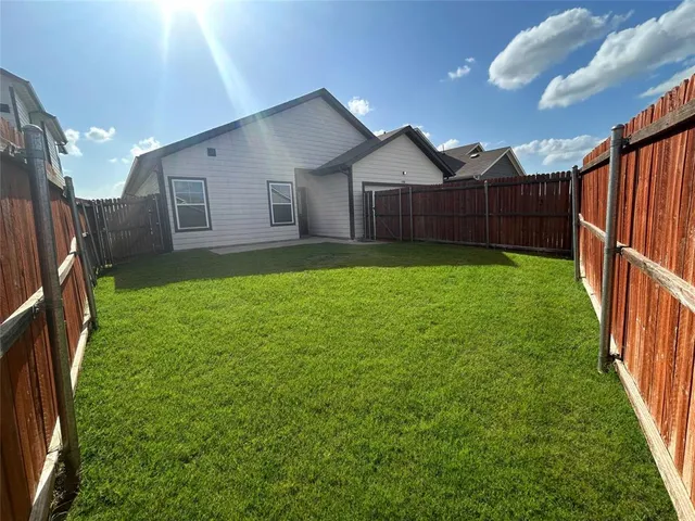 a house view with a garden space