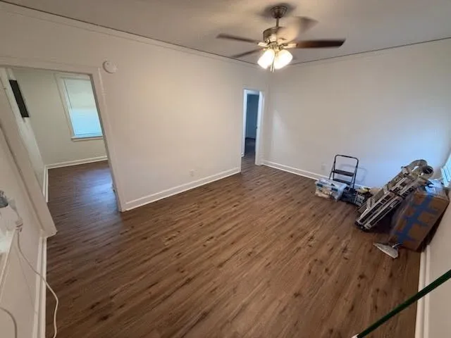 a view of a workspace with wooden floor