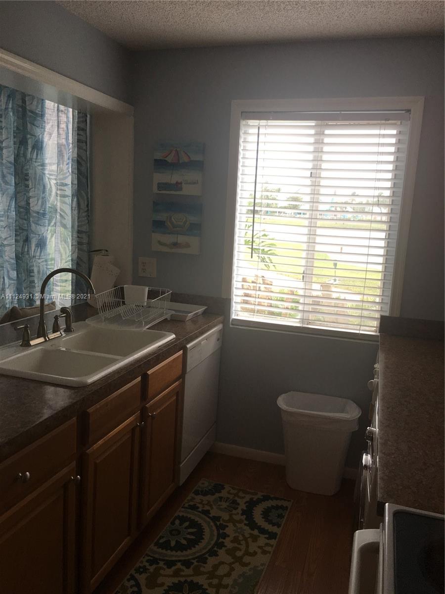 353 Highway 1, Unit D103 Jupiter, FL 33477 - Photo 5 of 11 a bathroom with a sink toilet and window