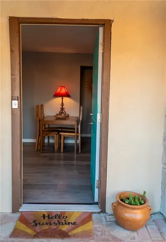 a kitchen with stainless steel appliances granite countertop white cabinets and a stove top oven