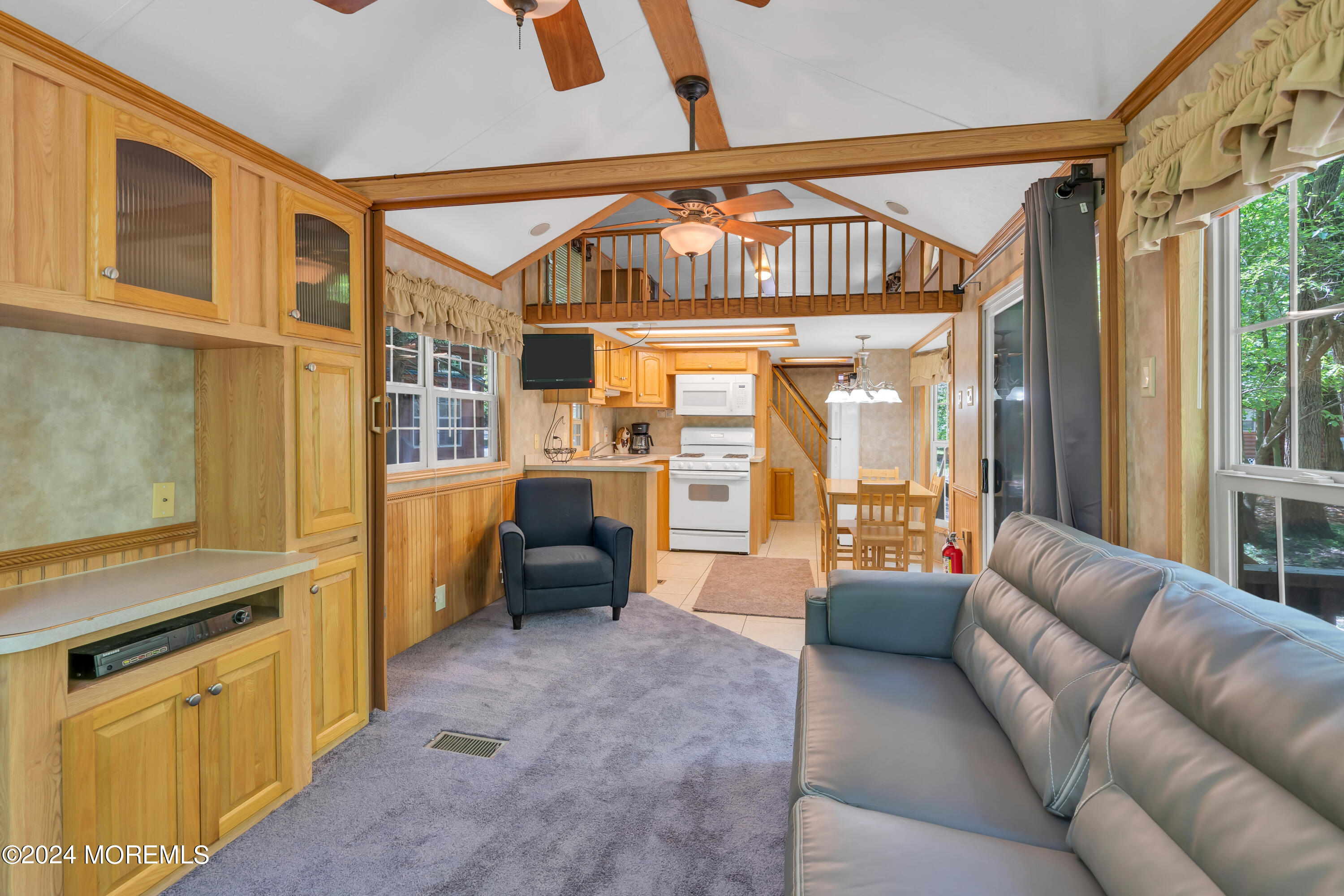 724 Monmouth Road, Unit 36 Cream Ridge, NJ 08514 - Photo 8 of 25 a living room with furniture and a chandelier