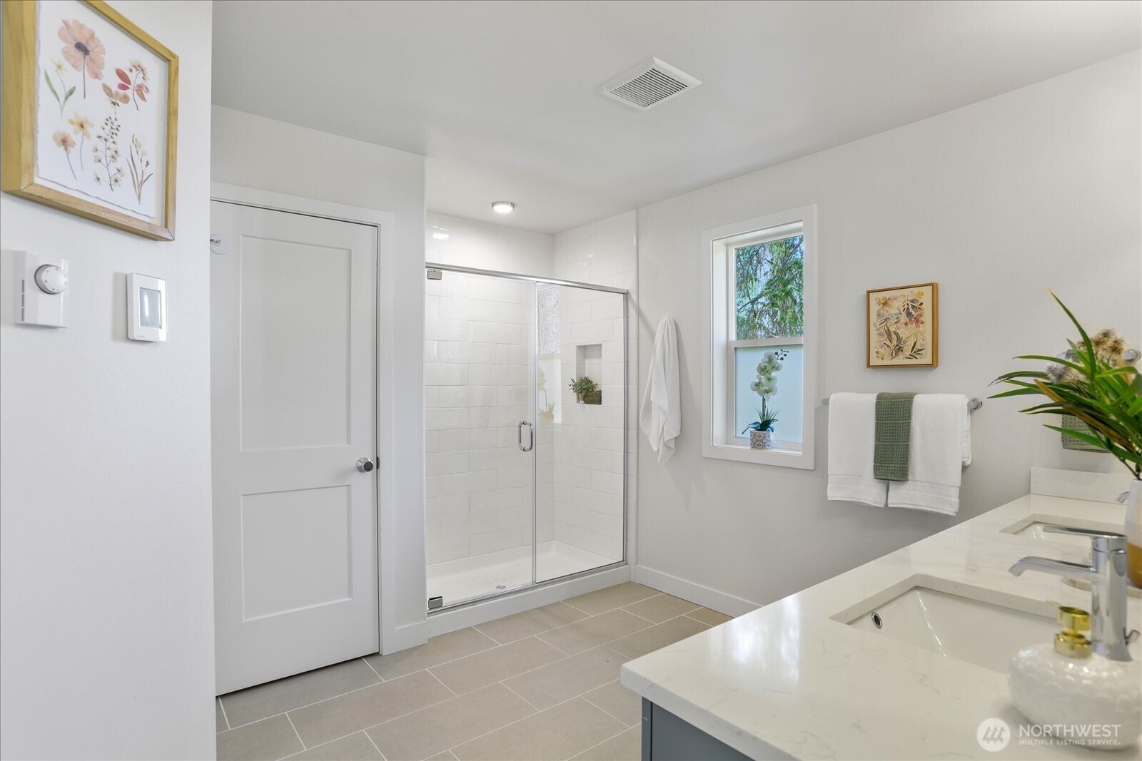 121 171st Place Southwest, Unit B Bothell, WA 98012 - Photo 26 of 36 a bathroom with a granite countertop sink a mirror a shower and a bathtub