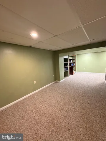 a view of a room with large windows