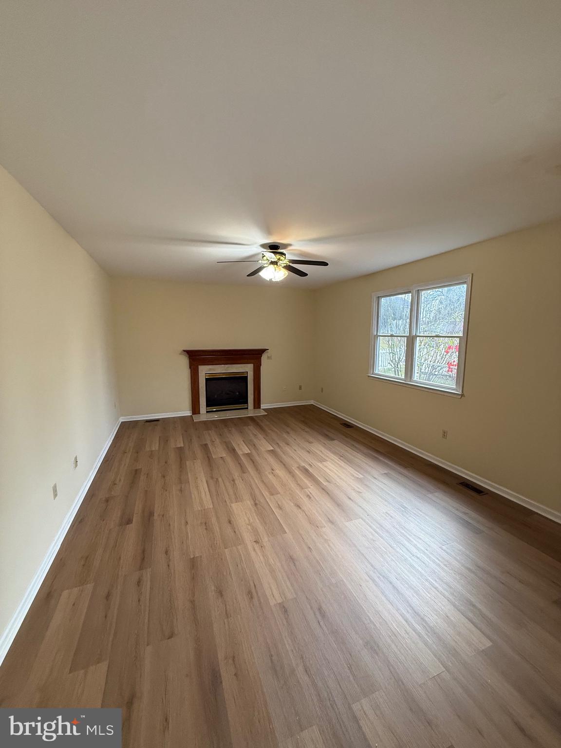 28 Willow Way Drive Enola, PA 17025 - Photo 4 of 22 a view of empty room with wooden floor and fan